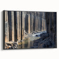 Framed canvas artwork showcasing a stunning landscape of canyons in vibrant colors, viewed from the side against a black frame, perfect for home decor.