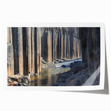 Vibrant landscape print depicting majestic canyons in rich earthy tones, rolled and packaged in a protective cardboard tube, ideal for home decor or art enthusiasts.