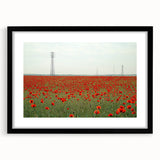 Black-framed landscape artwork showcasing a serene countryside scene with vibrant greenery and rolling hills, designed to enhance home decor aesthetics.