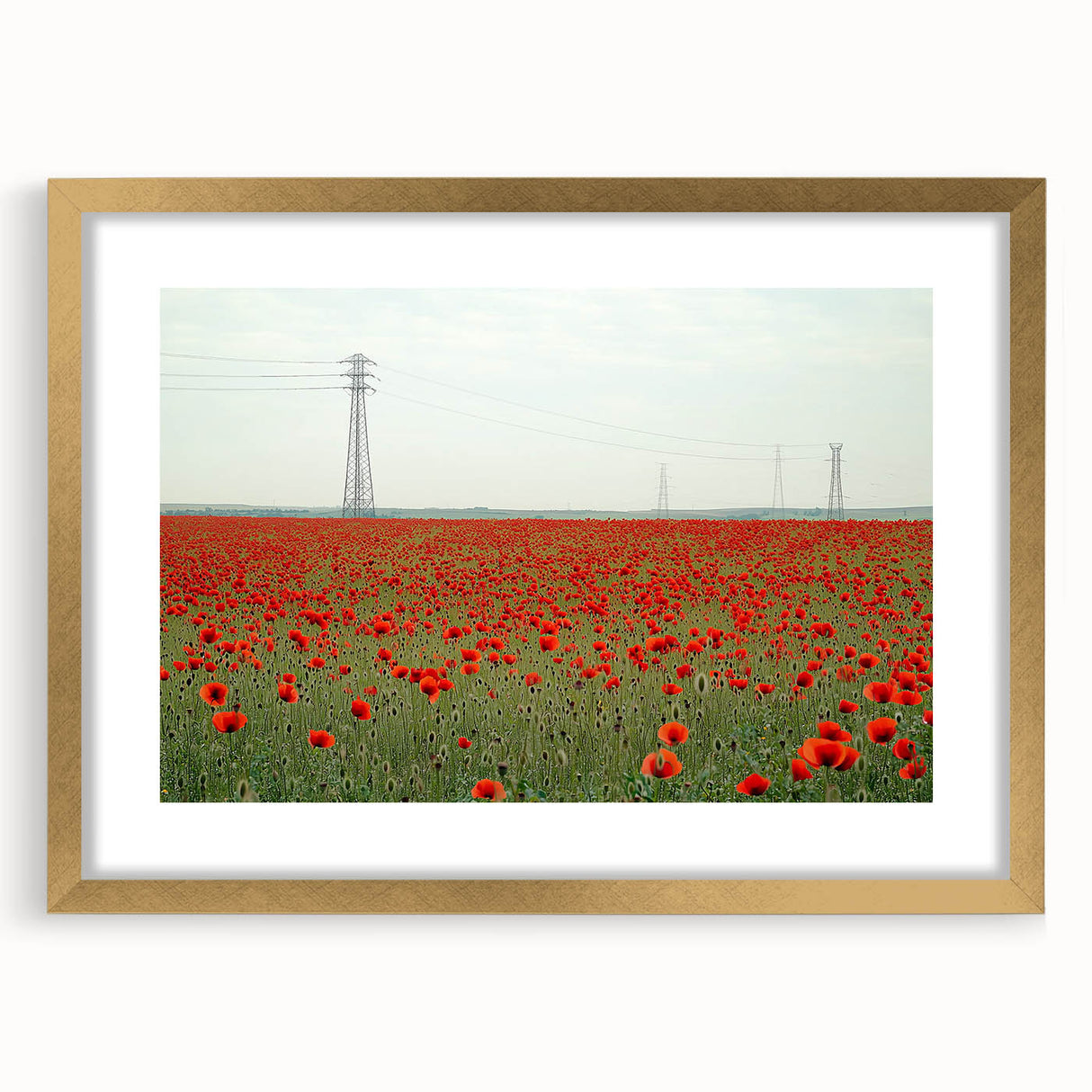 Elegant gold-framed landscape artwork depicting serene countryside scenery, showcasing vibrant greens and soft blue skies, perfect for home decor enhancement.