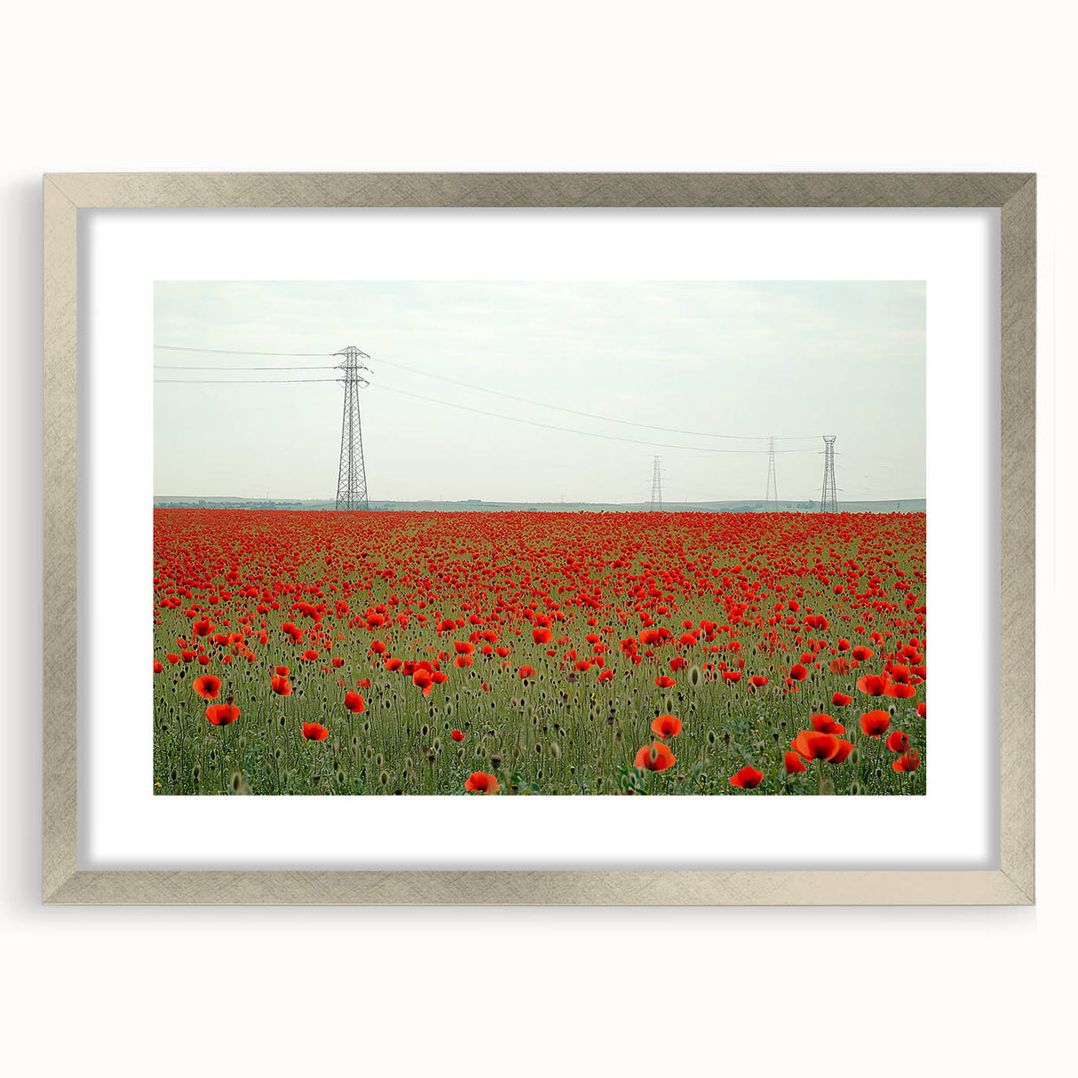 Elegant silver-framed landscape artwork depicting a serene countryside scene, complete with a white mat for a polished presentation, ideal for home decor.