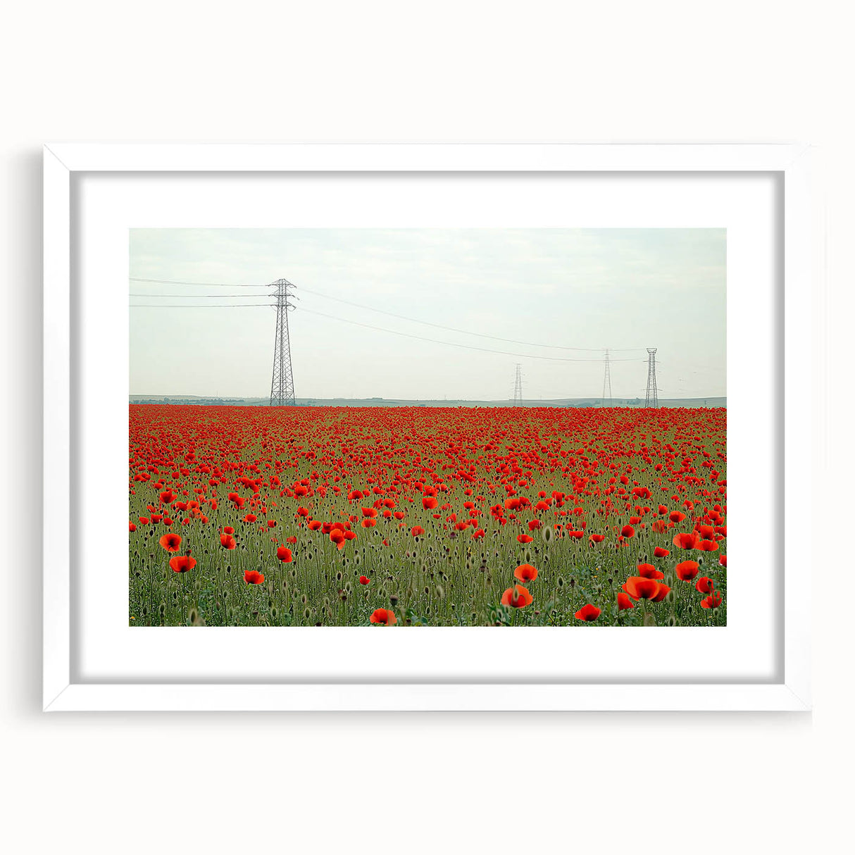 Framed landscape artwork depicting a serene countryside scene with a white mat, showcasing vibrant greens and blues, ideal for home decor enhancement.