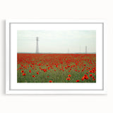 Framed landscape artwork depicting a serene countryside scene with a white mat, showcasing vibrant greens and blues, ideal for home decor enhancement.