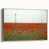 Framed canvas artwork depicting a serene countryside landscape with lush green hills and a bright blue sky, accented by a stylish gold frame, ideal for home decor.