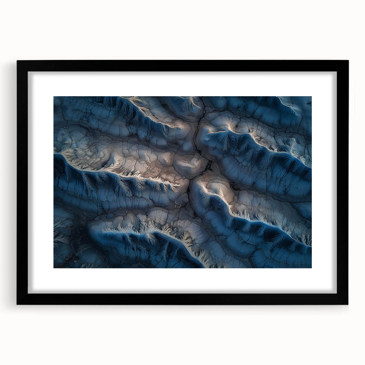Framed desert landscape artwork with a black mat, showcasing vibrant hues of orange and yellow against a serene blue sky, ideal for modern home decor.