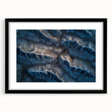 Framed desert landscape artwork with a black mat, showcasing vibrant hues of orange and yellow against a serene blue sky, ideal for modern home decor.