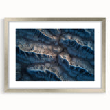 Framed desert landscape artwork with a silver mat, showcasing vibrant colors and intricate details, perfect for enhancing any living space or office decor.