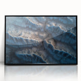 Framed acrylic artwork depicting a serene desert landscape, featuring warm tones of orange and beige, with a sleek black frame enhancing its modern aesthetic. Perfect for home decor enthusiasts.