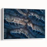 Framed canvas artwork depicting a serene desert landscape, featuring warm tones of orange and beige with a white frame, perfect for modern home decor.