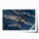 Desert landscape rolled print showcasing vibrant hues of orange and yellow, featuring textured details, packaged securely in a sturdy tube for protection. Perfect for home décor and art enthusiasts.