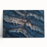 Stretched canvas artwork depicting a serene desert landscape with vibrant hues of orange and blue, perfect for enhancing home decor and creating a calming atmosphere.