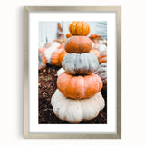 Textured abstract art print of autumnal colors on a silver-framed canvas, ideal for bedroom ambiance.