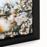Black wall art featuring a textured spring scene with vibrant colors on a framed canvas, ideal for living room decor.