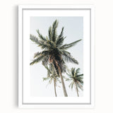 Abstract art print featuring swirling patterns in vibrant orange and yellow tones, framed in white.