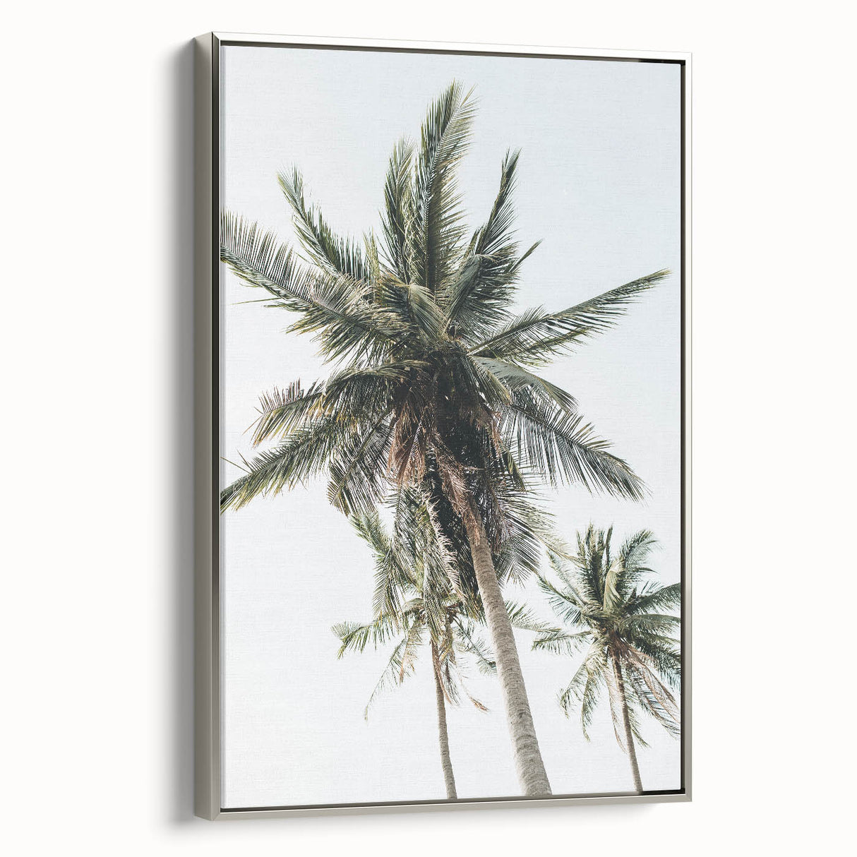 Framed canvas depicting a summer landscape with vibrant green trees under a clear blue sky, ideal for living room decor.