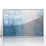 Framed abstract wall art featuring vibrant strokes in shades of blue, orange, and white, designed to enhance modern home decor with a contemporary touch.