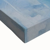 Abstract wall art featuring vibrant strokes in shades of blue, pink, and gold on stretched canvas, showcasing a modern artistic design ideal for contemporary decor. Perfect for enhancing living spaces or galleries.