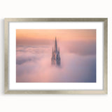 Framed landscape artwork depicting a majestic castle surrounded by lush greenery, with a silver mat finish enhancing its elegant presentation. Perfect for home decor.