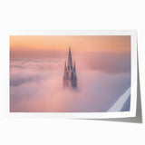 Rolled print showcasing a vibrant landscape with a majestic castle set against a serene sky, elegantly packaged in a protective cardboard tube for safe delivery.