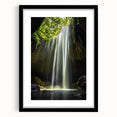 Framed landscape art featuring a serene cave scene, highlighted by a black mat and sleek frame. Ideal for home decor, this artwork adds a touch of nature's beauty to any space.