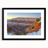 Black framed artwork featuring a dramatic landscape of cliffs, presented with a white mat and showcasing vibrant colors, ideal for home or office decor.