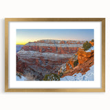 Framed landscape artwork showcasing dramatic cliffs in vibrant colors, set within a gold matting, ideal for enhancing home decor with an elegant touch.