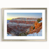Silver-framed landscape artwork showcasing dramatic cliffs and serene nature scenery, elegantly matted for a sophisticated display in home decor settings. Perfect for enhancing interior aesthetics with natural beauty.
