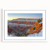 Framed landscape artwork showcasing majestic cliffs with a white mat, ideal for home decor, emphasizing natural beauty and tranquility in a contemporary setting.