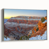 Framed canvas art featuring a serene landscape of cliffs, showcasing vibrant colors and intricate details, with a sleek silver frame enhancing its aesthetic appeal.