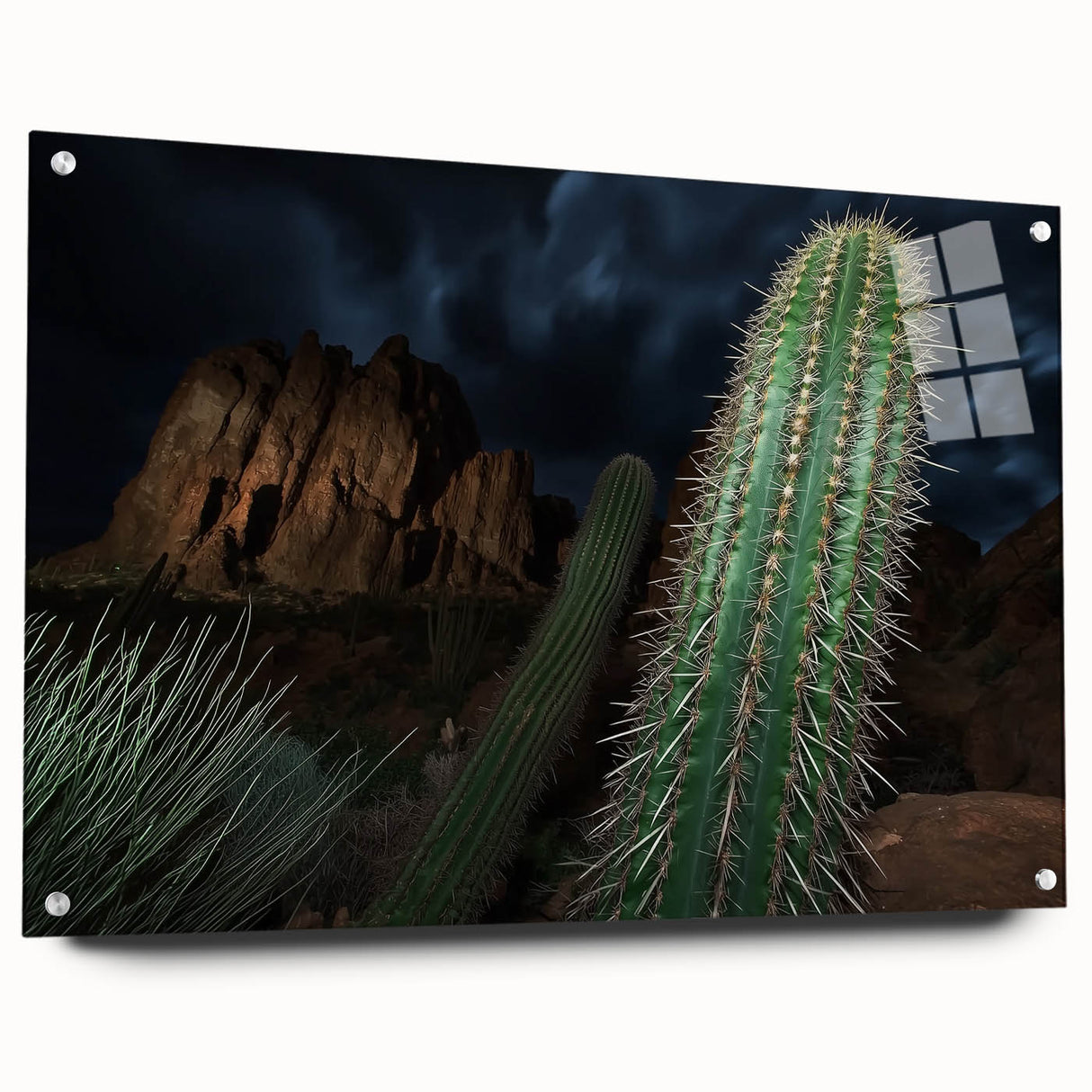Acrylic glass landscape artwork depicting vibrant canyons in rich hues of orange and blue, displayed from a side view with decorative pins for mounting.