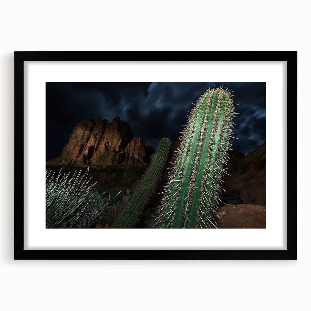 Black-framed landscape art print featuring a vibrant canyon scene with intricate details, designed to enhance home decor and create a serene ambiance.