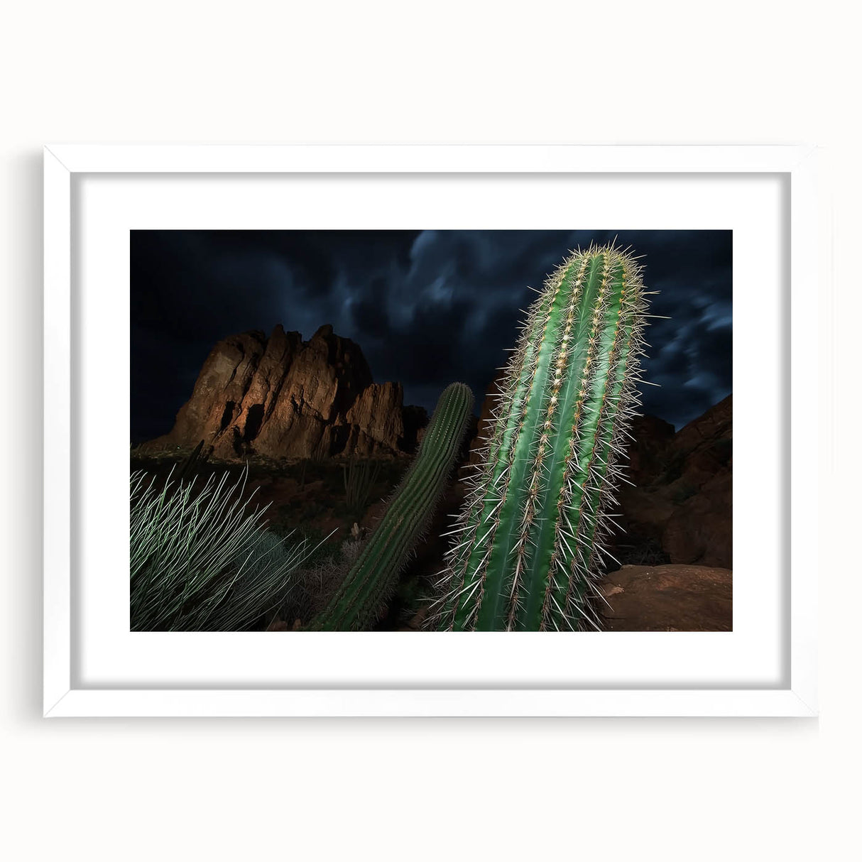 Framed landscape artwork depicting vibrant canyons with a white mat, showcasing intricate details and rich colors, ideal for home decor and nature enthusiasts.