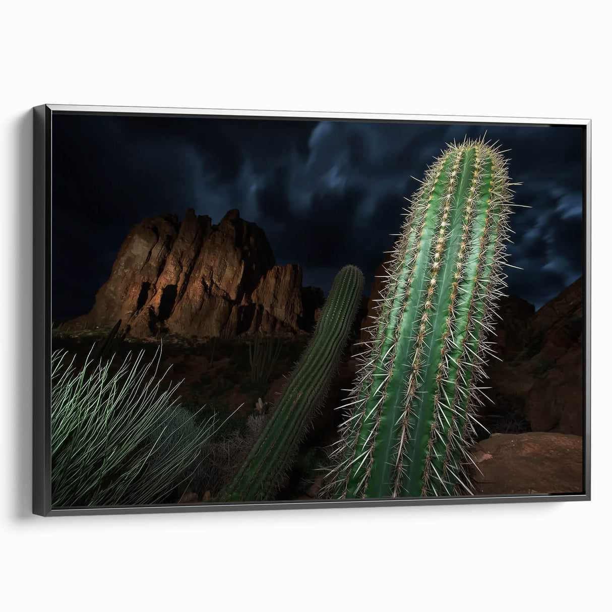 Framed canvas artwork showcasing a stunning landscape of canyons in rich earth tones, with a sleek black frame, ideal for enhancing modern home decor.