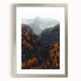 Textured abstract art print depicting autumnal hues on a silver-framed canvas, suitable for enhancing bedroom decor.