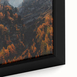 Framed canvas featuring a textured, colorful abstract design in autumn hues on a black background.