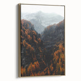 Framed canvas featuring a vintage-style landscape painting with autumnal trees in gold and black tones.