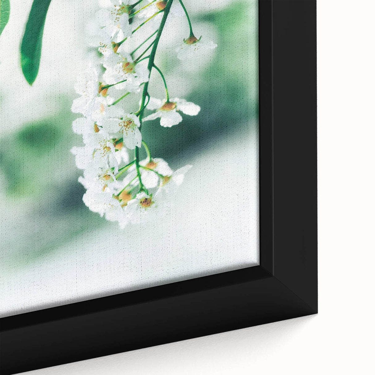 Close-up of textured black wall art featuring vibrant spring-themed colors on a large framed canvas.