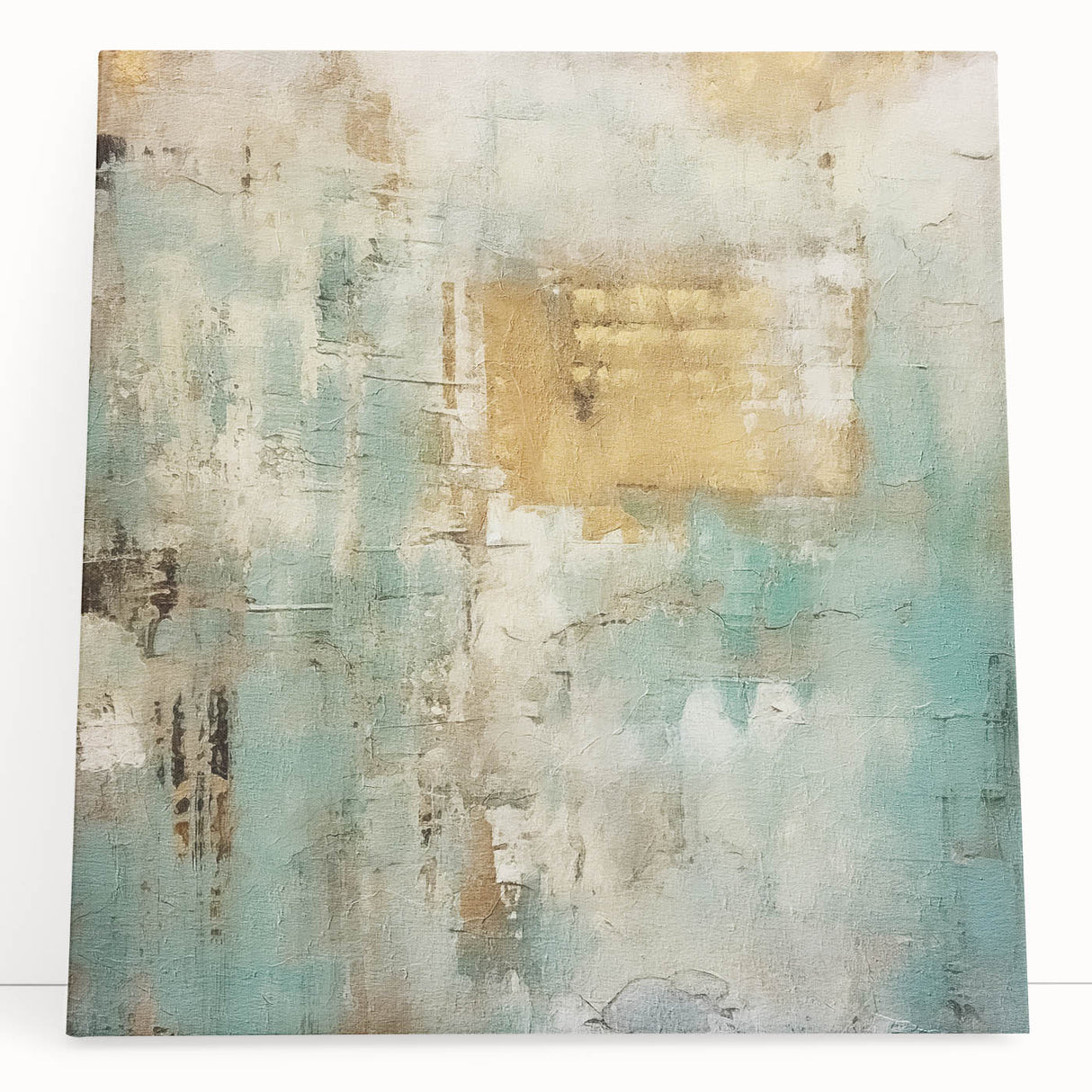 Abstract canvas wall art showcasing vibrant strokes in shades of blue, orange, and yellow, elegantly leaning against a wall, adding a modern touch to interior decor.
