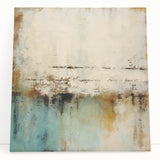 Abstract wall art featuring vibrant strokes in blue, orange, and yellow hues on a stretched canvas, leaning against a neutral wall, ideal for modern decor.