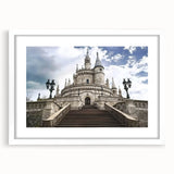 White-framed landscape artwork showcasing a majestic castle surrounded by lush greenery, ideal for home decor or gallery display, exuding elegance and tranquility.