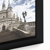 Close-up of a framed canvas artwork depicting a serene landscape with a majestic castle nestled among lush greenery, showcasing vibrant colors and intricate details, ideal for home décor.