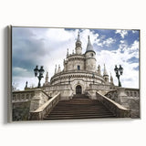 Framed canvas artwork showcasing a picturesque landscape with a majestic castle, elegantly bordered in silver, highlighting the vibrant colors and intricate details. Perfect for enhancing home decor.