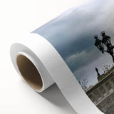 Landscape canvas artwork showcasing a serene castle scene with lush greenery and a clear blue sky, rolled and ready for display, offering a tranquil home decor option.