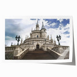 Rolled print showcasing a picturesque landscape with a majestic castle surrounded by lush greenery, ideal for home decor or art enthusiasts, packaged securely for delivery.
