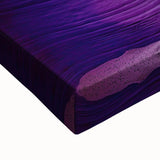 Close-up of a stretched canvas artwork depicting a vibrant landscape with intricate cave formations, showcasing rich colors and textures, ideal for modern home decor.