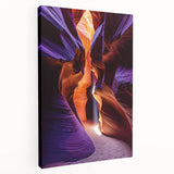 Stretched canvas artwork showcasing a vibrant landscape scene featuring caves and natural formations, ideal for enhancing home decor with earthy tones and dramatic scenery.