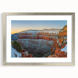 Framed landscape artwork showcasing dramatic cliffs in silver finish, featuring a white mat for enhanced presentation, perfect for modern home decor.