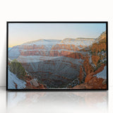 Framed acrylic artwork showcasing a stunning landscape of rugged cliffs, set against a vibrant sky. The black frame adds elegance, making it perfect for modern decor.