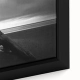 Framed canvas art depicting a serene beach landscape with vibrant colors, showcasing gentle waves and a clear sky, perfect for coastal home decor.