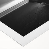 Vibrant rolled canvas depicting a serene beach landscape with soft waves and a clear blue sky, elegantly packaged in a protective cardboard tube for easy transport.